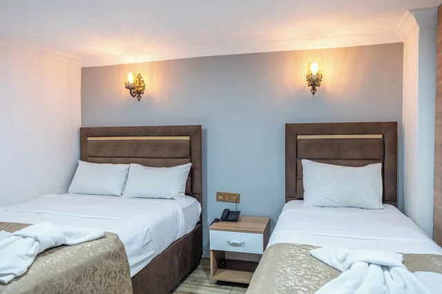 غرفة اقتصادية رباعية بسرير مزدوج وسريرين منفصلين بغرفة نوم واحدة، Laos Otel 3/10