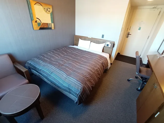 غرفة بسرير كوين في المبنى الرئيسي للمدخنين، Hotel Route-Inn Iwakiizumi Ekimae 4/8