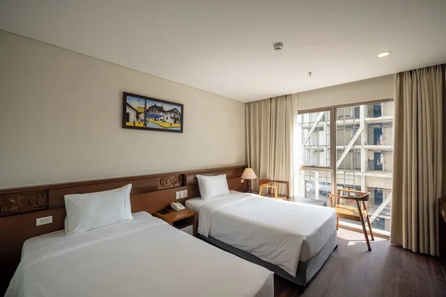 غرفة سوبيريور بسريرين منفصلين بإطلالة جزئية على البحر، Tamarind Hotel Da Nang 1/10