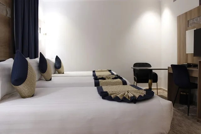 غرفة ثلاثية بثلاثة أسرّة، Abraj Almarzam Hotel 4/7