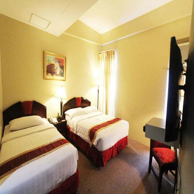 غرفة ديلوكس بسرير كينج، Sarrosa International Hotel And Residential Suites 1/2