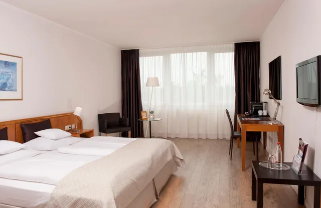 غرفة بريفيليج بسرير كينج، Wyndham Hannover Atrium 1/4