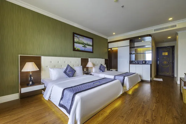 غرفة ديلوكس بسريرين منفصلين وسرير كوين بإطلالة على البحر، Thien Thanh Resort 3/6