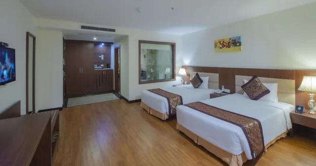 غرفة ديلوكس ثلاثية بسرير كينج وسرير فردي بإطلالة على المدينة، Muong Thanh Grand Da Nang Hotel 1/9