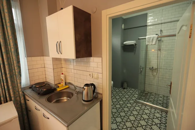 غرفة ديلوكس عائلية بسرير مزدوج وسرير فردي مع أريكة، White Pearl Apart 2/3