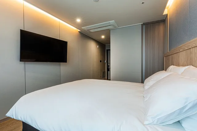 غرفة ديلوكس بسرير كوين وسرير فردي، Jeju Bolton Hotel 5/7