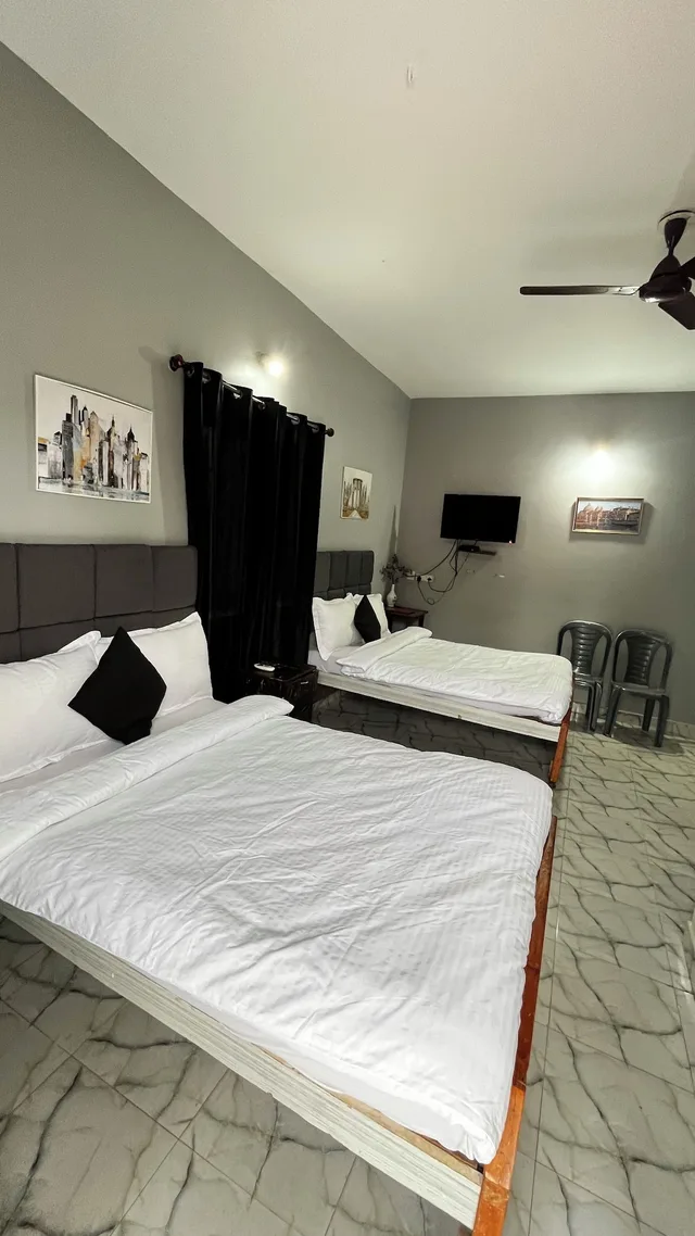 غرفة ديلوكس رباعية بسريرين منفصلين، Casa Almeida Guest House 1/4