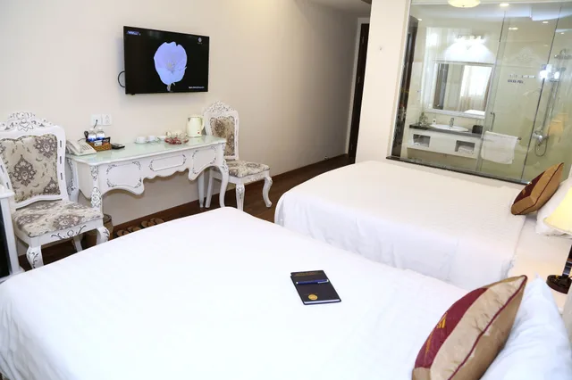 غرفة ديلوكس بسرير مزدوج وسرير فردي، Tuyet Son Hotel 4/9
