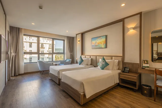 غرفة ديلوكس بسرير كينج وسريرين منفصلين، Sunset Beach Resort Spa 1/2