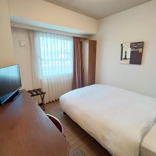 غرفة مفردة بحمام خاص في المبنى الرئيسي، Hotel Route-Inn Iwakiizumi Ekimae 1/4