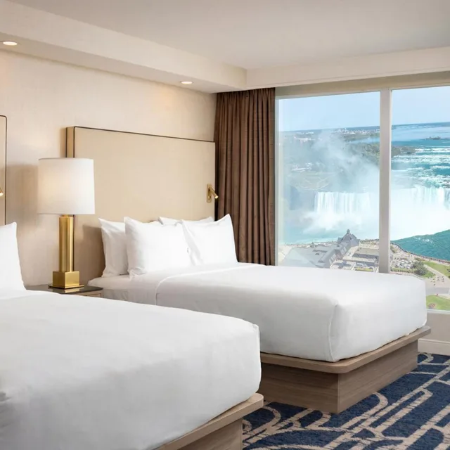 2 Rooms, Suite, 4 Queen Beds, Canadian Falls View، Embassy Suites By Hilton Niagara Falls Fallsview 1/3