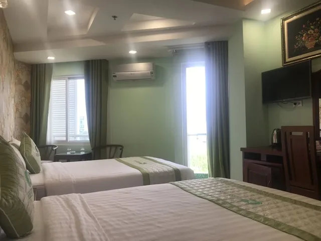 غرفة ديلوكس رباعية بسريرين مزدوجين بإطلالة على المتنزه، Green Park Hotel Quy Nhon 2/7