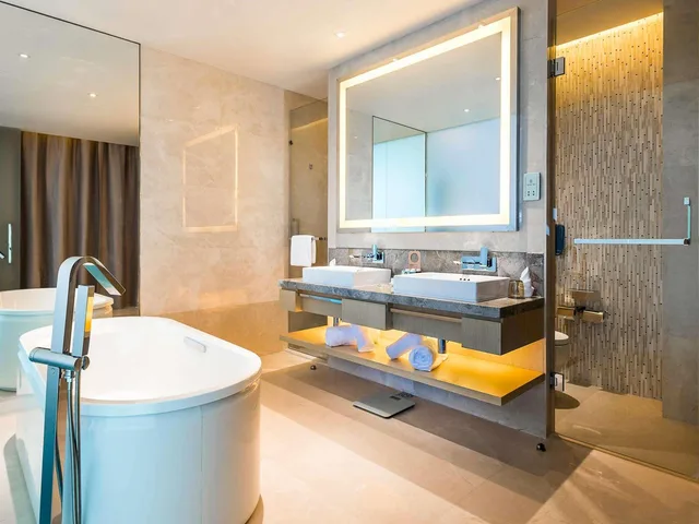 جناح ديلوكس بسرير كينج وسرير كوين، Novotel Suzhou Sip 4/4