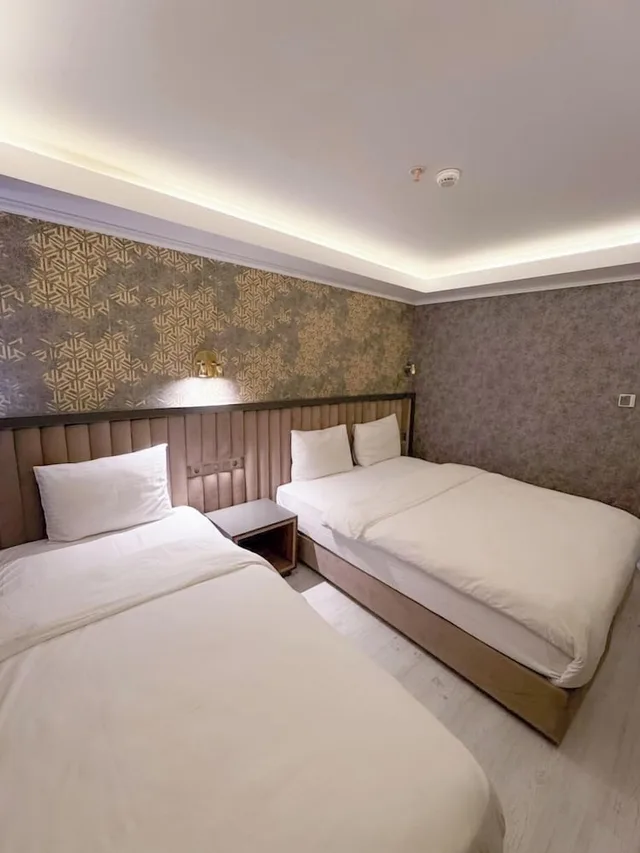 غرفة عائلية ثلاثية بسرير كينج وسرير فردي بإطلالة على المدينة، Sultan City Hotel 3/10
