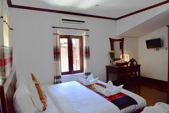 غرفة ديلوكس ثلاثية بسرير كينج وسرير فردي، Thatsaphone Hotel 1/9