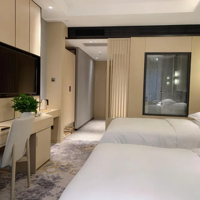 غرفة ديلوكس بسريرين منفصلين بإطلالة على المدينة للمدخنين، Grand Metropark Hotel Liyuan Chongqing 1/6