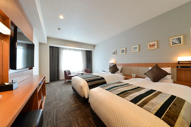 غرفة متصلة بريميوم بأربعة أسرّة وسريرين منفصلين، Hakodate Kokusai Hotel 1/3