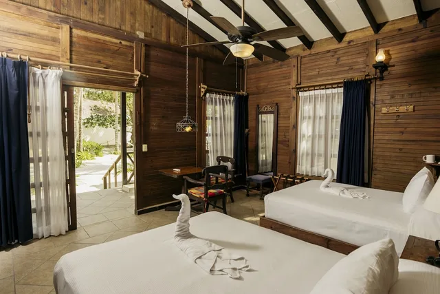 Palm, Beach, Bungalow, 2 Double Beds, 3 Double Beds, Petit Lafitte Hotel 1/9
