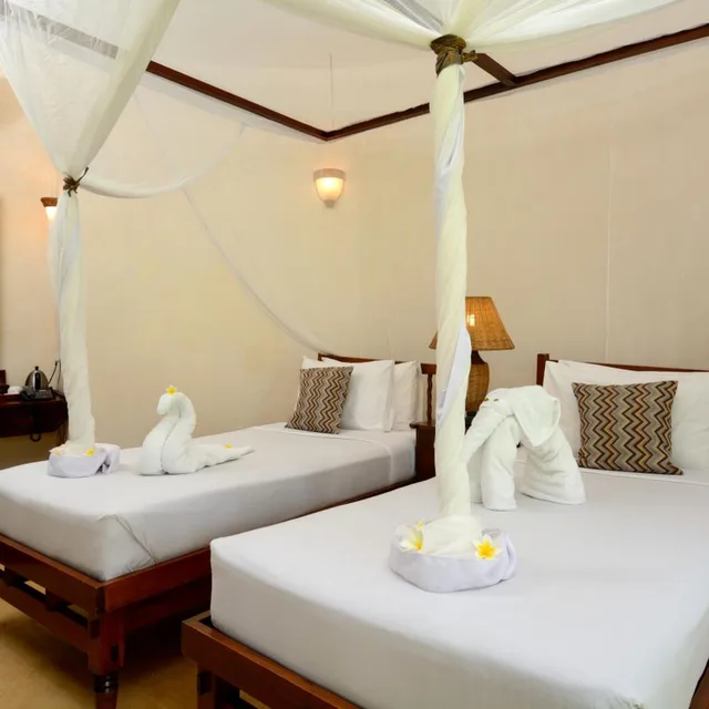 غرفة بسريرين منفصلين بإطلالة على البحر، Ocean Paradise Resort Zanzibar 1/2