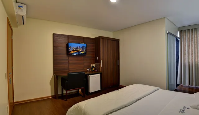 غرفة غراند بثلاثة أسرّة، Porto Minas Hotel e Convencoes 2/7