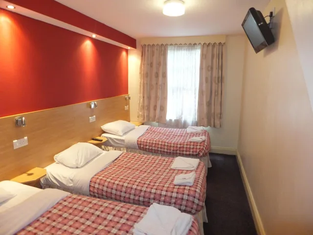 Family, 1 Double and 3 Single Beds, Carlton Hotel 1/2