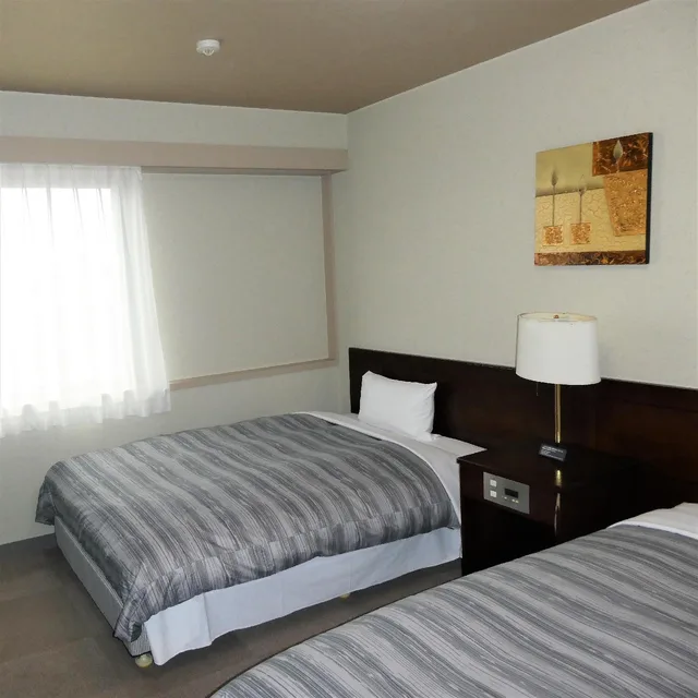 غرفة بسريرين منفصلين في المبنى الرئيسي، Route-Inn Grantia Akita Spa Resort 1/1