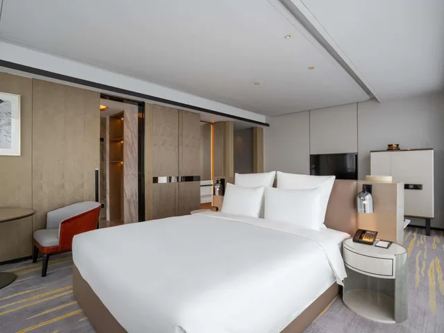غرفة ديلوكس بسرير كينج وسرير كوين، Pullman Suzhou Zhonghui 3/5