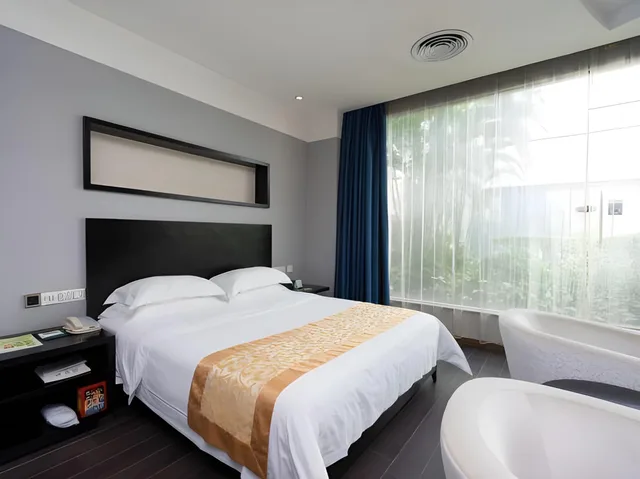 غرفة تنفيذية بسرير كوين، Guangdong Nanmei Osotto Hotel 1/2