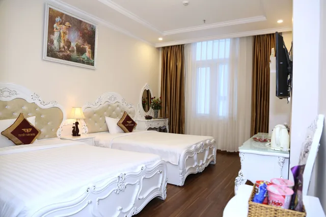 غرفة ديلوكس بسرير مزدوج وسرير فردي، Tuyet Son Hotel 1/9