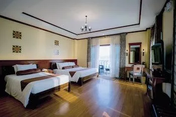 غرفة ديلوكس ثلاثية بسرير كينج بإطلالة على البحر، Sunlight Guest Hotel - Coron 1/1