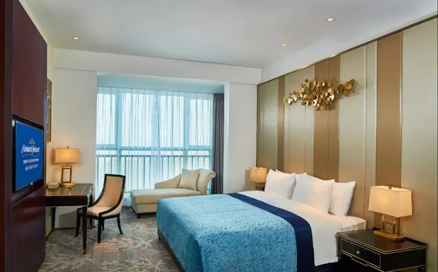 جناح ديلوكس بسرير كينج بإطلالة على البحر للمدخنين، Howard Johnson by Wyndham Dream Sea Resort Weihai 1/1