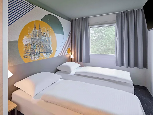 غرفة بسريرين منفصلين، B&B HOTEL Koln-Marsdorf 1/4