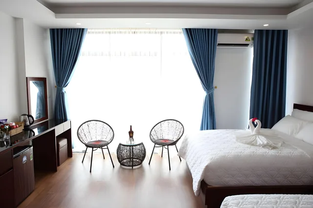 غرفة ديلوكس رباعية بسريرين كينج، Camellia Hotel 3/3