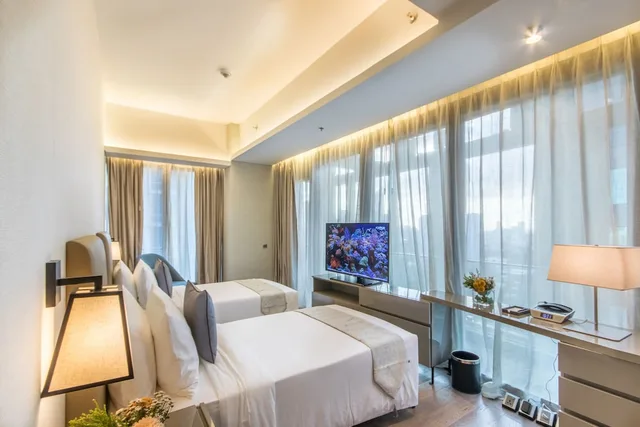 جناح تنفيذي بسرير كينج وسريرين فرديين بغرفتي نوم، Im Hotel 2/3