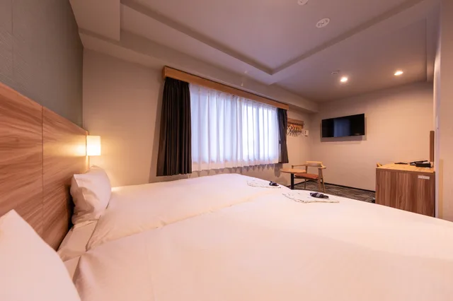 غرفة عائلية بسريرين منفصلين في الملحق، Central Hotel Takeo 1/3