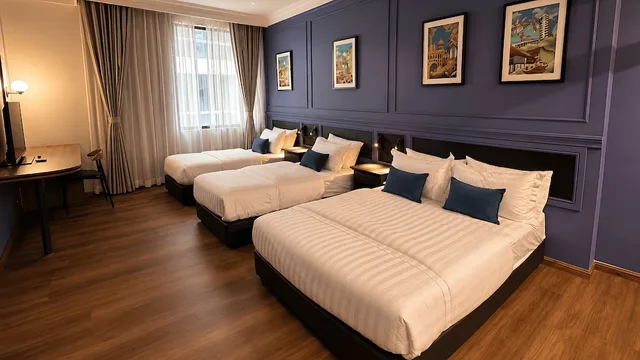 غرفة عائلية رباعية بسرير كوين وسريرين منفصلين بإطلالة على المدينة، Kuala Lumpur International Hotel 1/5