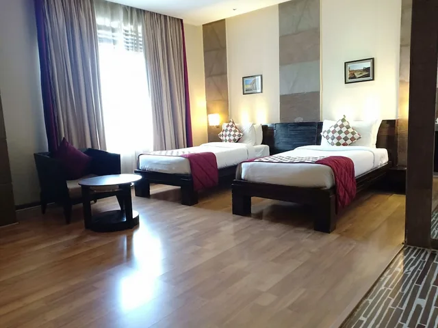 غرفة ديلوكس بسريرين منفصلين، Ramada by Wyndham Ajmer 1/8