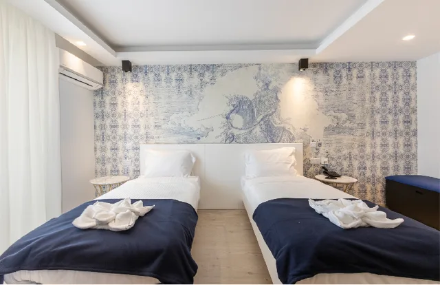 غرفة قياسية بسريرين منفصلين مع أريكة، The G Hotel by JL 2/2