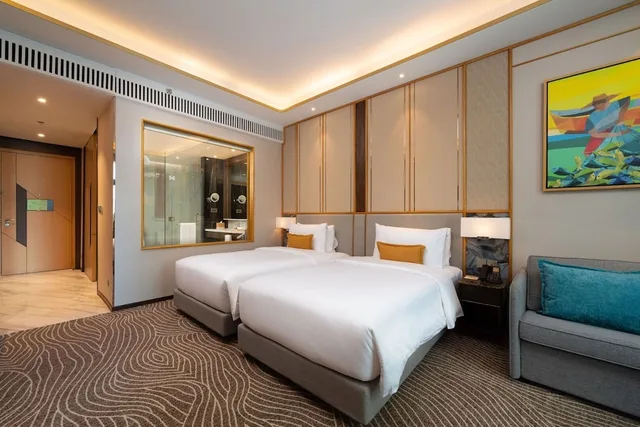 غرفة ديلوكس بسريرين منفصلين بإطلالة على البحر، Fili Hotel at NUSTAR Resort & Casino Cebu 3/4