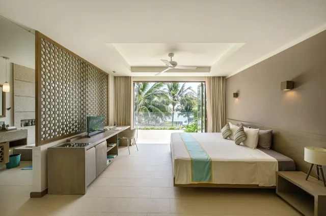غرفة بسرير كينج وسرير كوين بإطلالة على الحديقة بغرفة نوم واحدة، Mia Resort Nha Trang 1/10