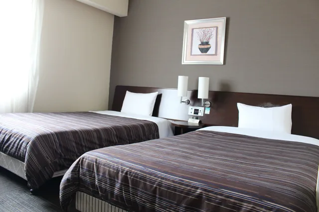 غرفة بسريرين منفصلين في المبنى الرئيسي للمدخنين، Hotel Route-Inn Iwakiizumi Ekimae 8/10