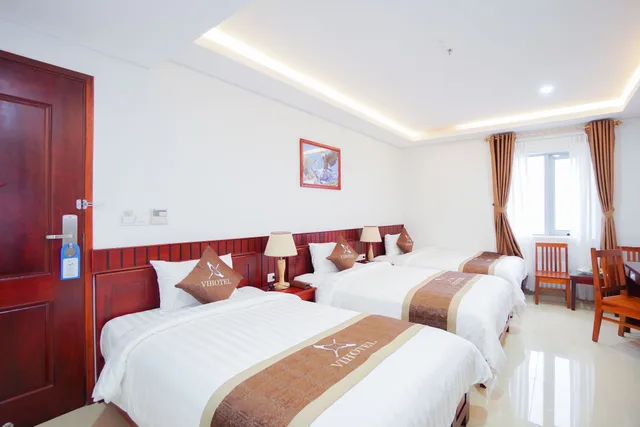 غرفة سوبيريور ثلاثية بسرير كوين وسرير فردي، Vinh Hoang Hotel 2/4