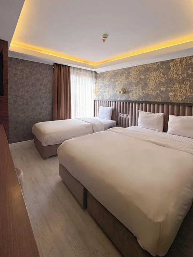 غرفة عائلية ثلاثية بسرير كينج وسرير فردي بإطلالة على المدينة، Sultan City Hotel 7/10