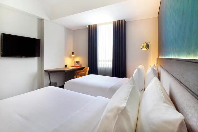 غرفة ديلوكس بسريرين منفصلين للمدخنين، Swiss-Belinn Airport Surabaya 2/4