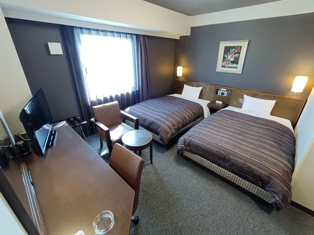 غرفة بسريرين منفصلين في المبنى الرئيسي للمدخنين، Hotel Route-Inn Iwakiizumi Ekimae 5/10