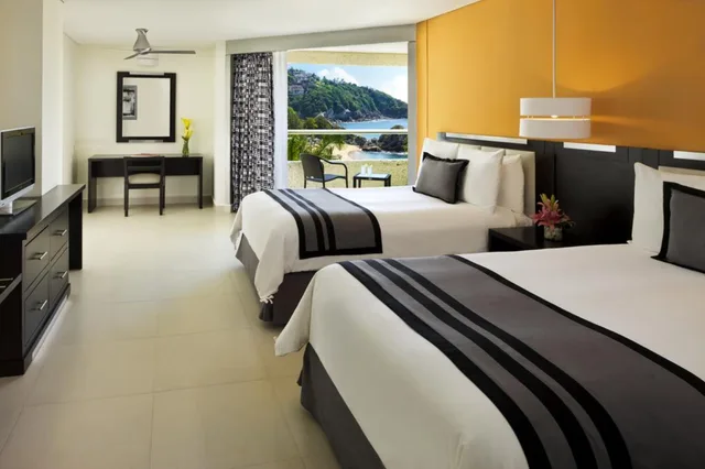 غرفة بسريرين مزدوجين بإطلالة جزئية على البحر، Dreams Huatulco Resort Spa All Inclusive 1/1