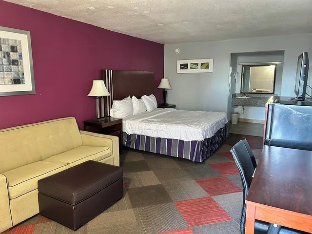 غرفة بسرير كينج، Executive Inn 1/9