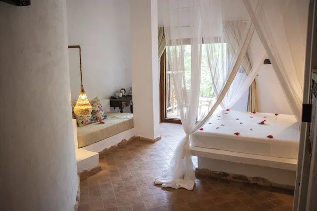 غرفة ديلوكس ثلاثية بسرير كينج وسرير فردي بإطلالة على الحديقة، Mvuvi Boutique Resort 10/10