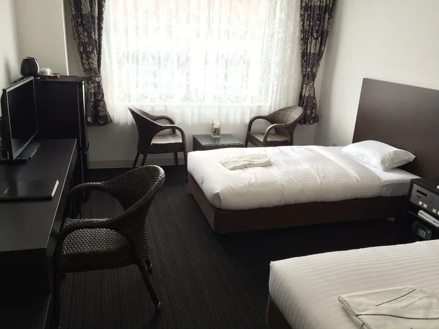 غرفة بسريرين منفصلين بإطلالة على المدينة، Libest Inn Amami 1/1