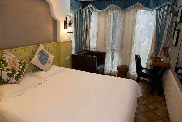 غرفة ديلوكس بسرير كوين، Yungu Garden Residence 1/3